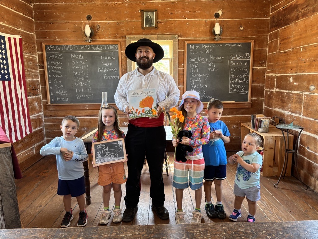 Interpreter holding a book with children